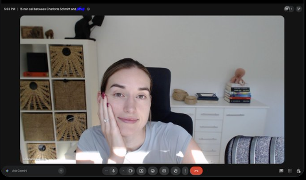 A founder sitting alone on a video call, chin resting on her hand, waiting for a prospect who never joined.